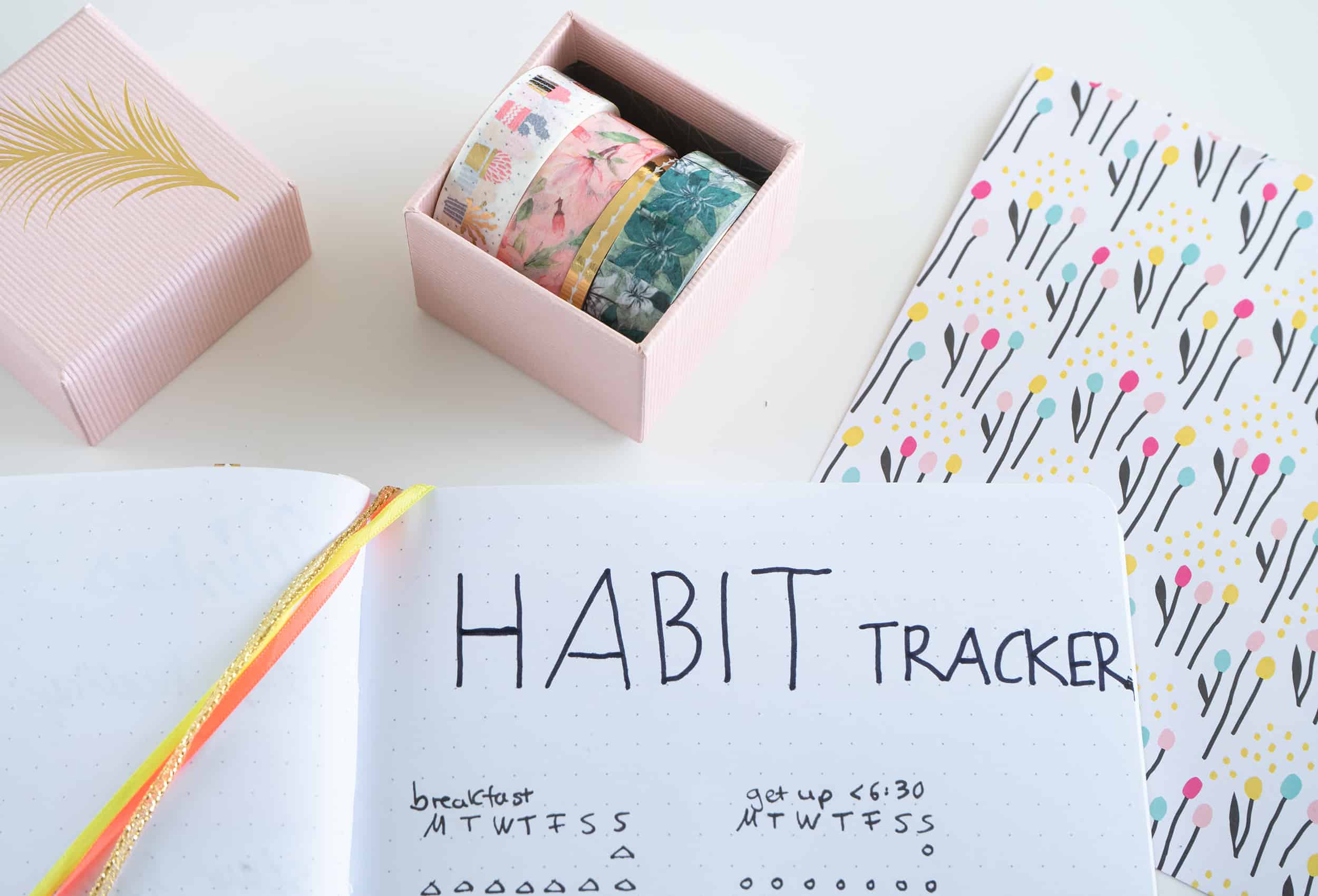 bullet-journal-habit-tracker-decorated-with-washi-tape-and-a-jewelry-box