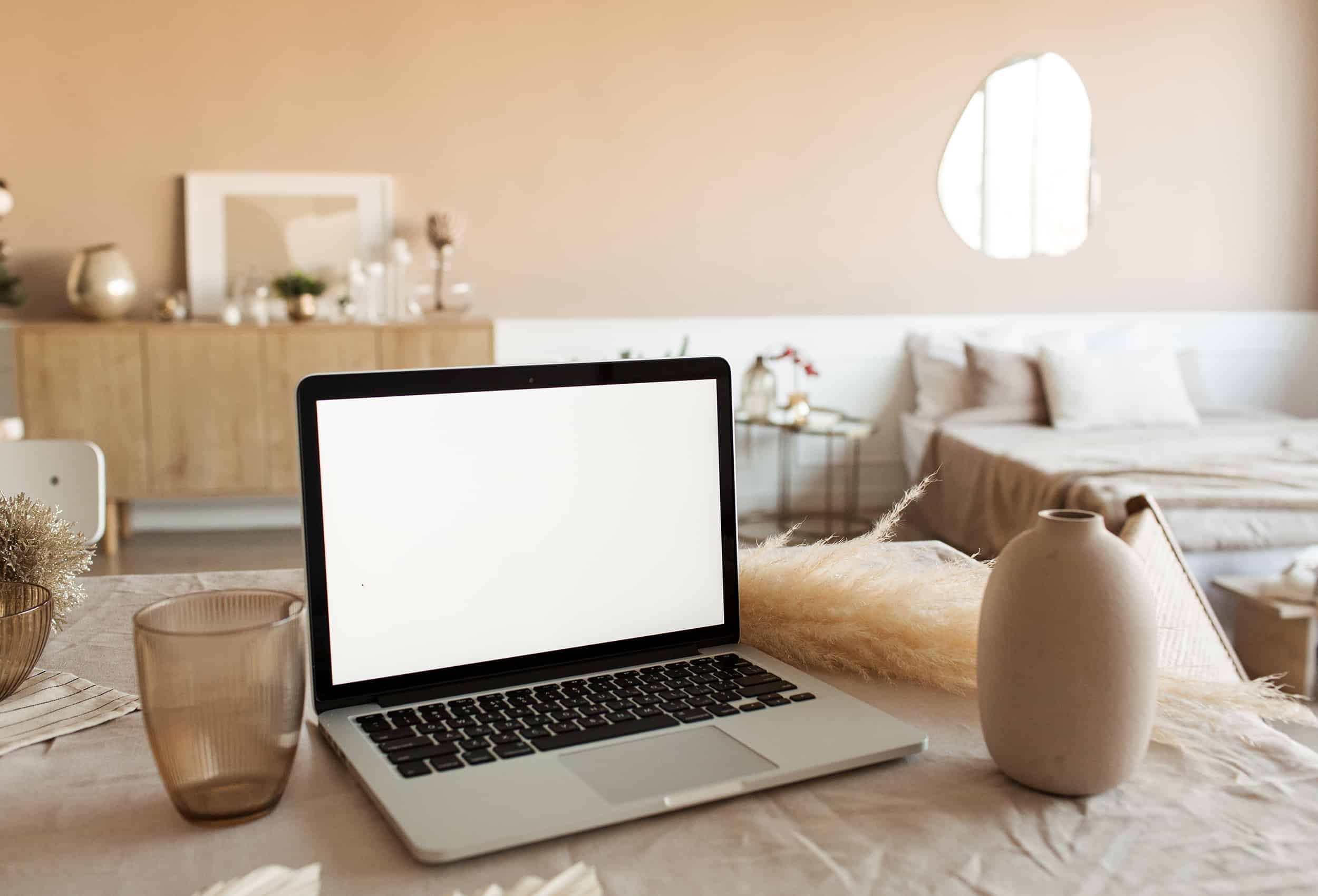 Blank-display-screen-laptop-on-table-with-beautiful-decorations