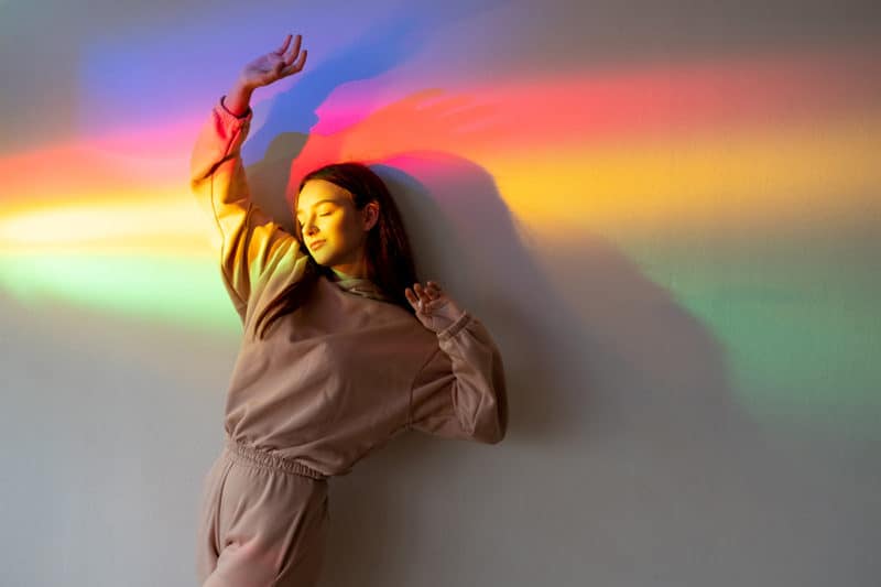 girl-in-sweats-rainbow-peace-vibration