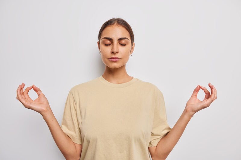 woman-in-beige-shirt-meditating-inner-peace-and-calm