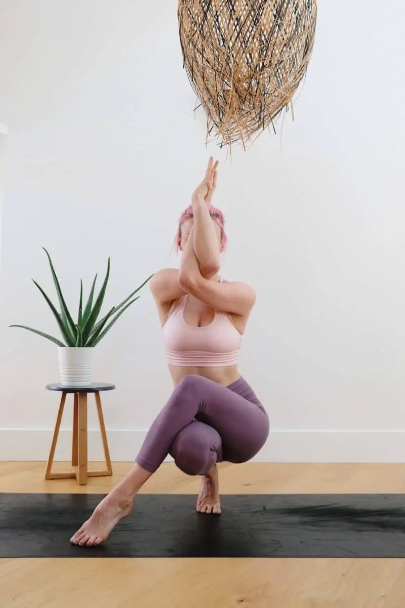 woman-pink-hair-yoga-eagle-pose