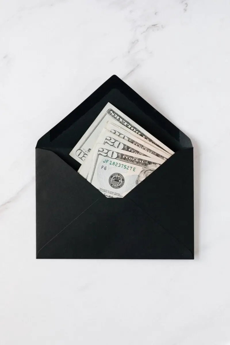 20-dollar-bills-in-black-envelope