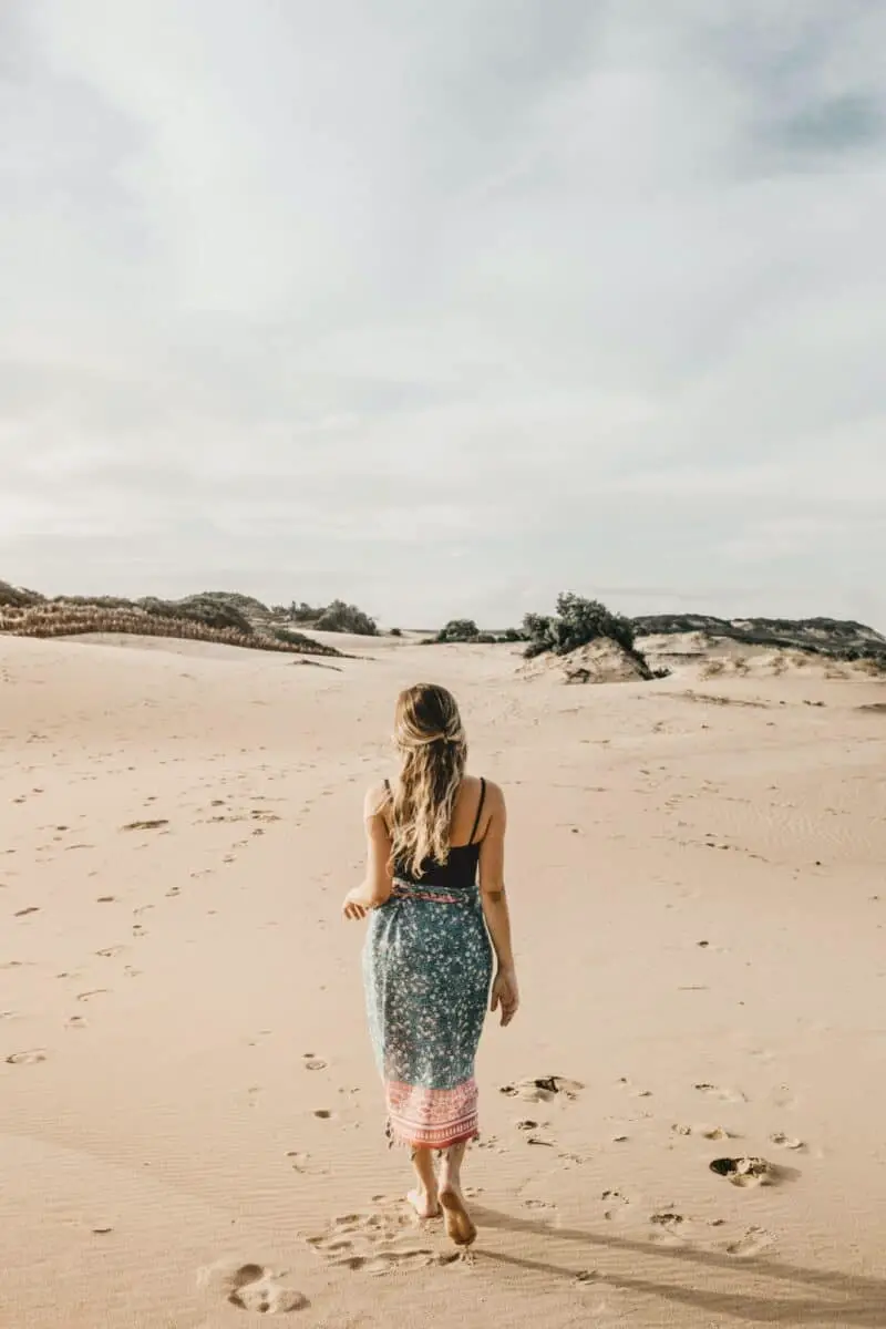 woman-in-skirt-on-beach-walking