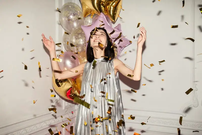 new-year-affirmations-asian-woman-wearing-silver-dress-festive-party-balloons
